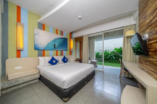 Ένα ή περισσότερα κρεβάτια σε δωμάτιο στο Bliss Surfer Hotel Legian