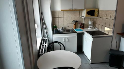 Kuchyň nebo kuchyňský kout v ubytování la chambre de Jade