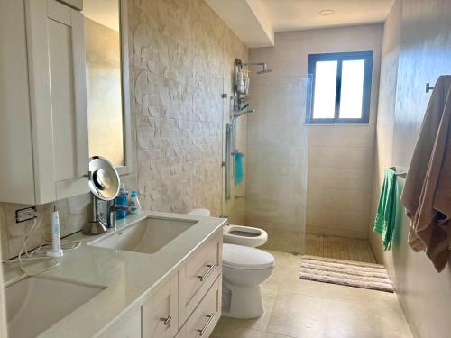 a bathroom with a sink and a toilet and a shower at Villas with breathtaking seaview in Marbella