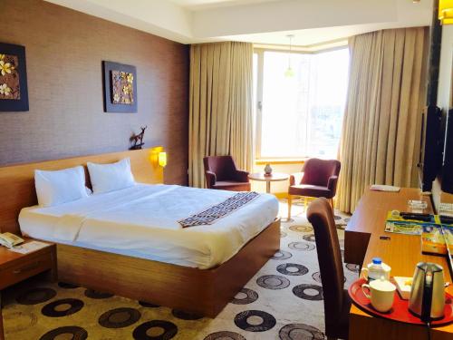 Katil atau katil-katil dalam bilik di Grand Palace Hotel Erbil