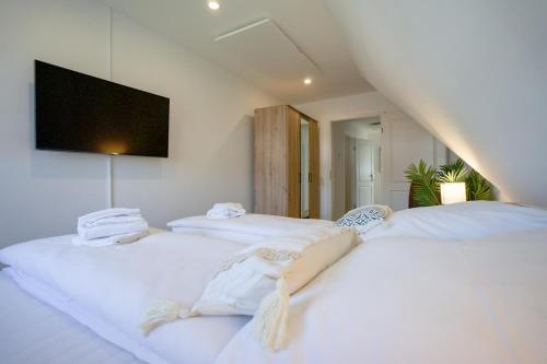 Ένα ή περισσότερα κρεβάτια σε δωμάτιο στο Himmelreich - Helle & moderne Ferienwohnung am Meer