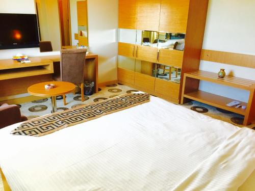 Katil atau katil-katil dalam bilik di Grand Palace Hotel Erbil