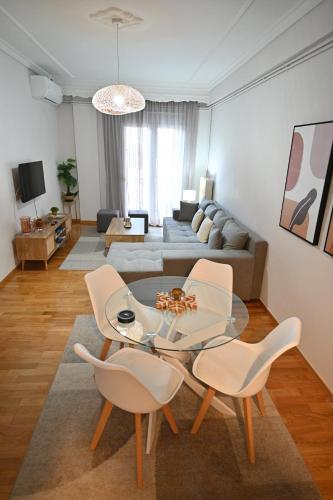 a living room with a table and two chairs at Panagiotidis lake house in Kastoria
