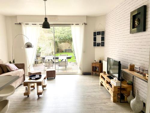 Appartement cosy avec jardin proche centre .