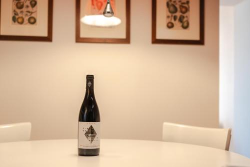 a bottle of wine sitting on top of a table at Borgo Syrah in Cortona