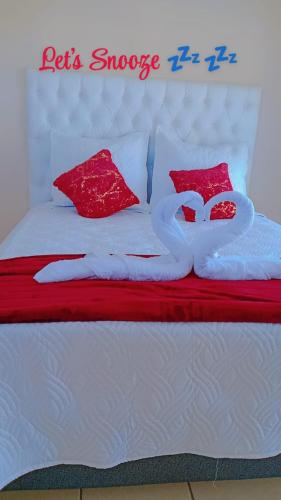 Cama o camas de una habitación en Snooze Guesthouse