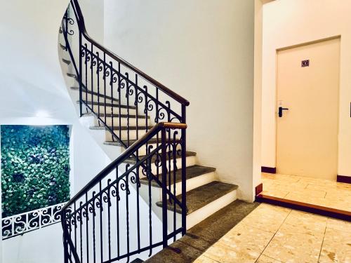 a staircase in a house with a door at GuestHouse University by LR - self check in in Lugano