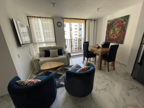 a living room with a couch and chairs and a table at Fontana campestre in Ibagué