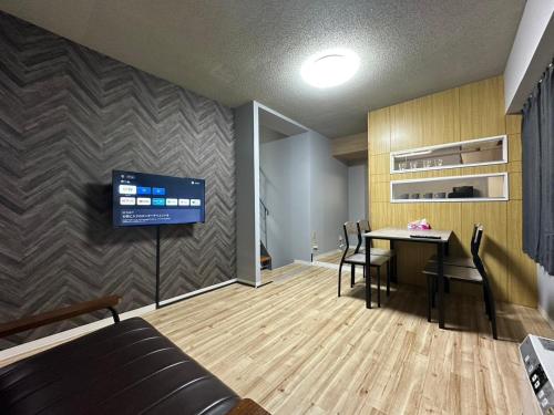 Televiisor ja/või meelelahutuskeskus majutusasutuses AMShiragishi 201