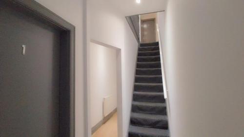a staircase in a room with a stair case at En-Suite Double-Bedroom in the Heart of Eccles Manchester Perfect for Short Stays BH5 in Manchester