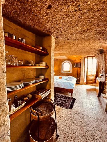 Ένα ή περισσότερα κρεβάτια σε δωμάτιο στο Les Maisons De Cappadoce