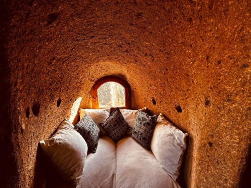 Ένα ή περισσότερα κρεβάτια σε δωμάτιο στο Les Maisons De Cappadoce