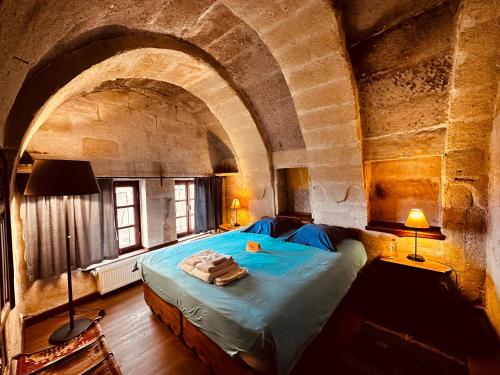 Ένα ή περισσότερα κρεβάτια σε δωμάτιο στο Les Maisons De Cappadoce