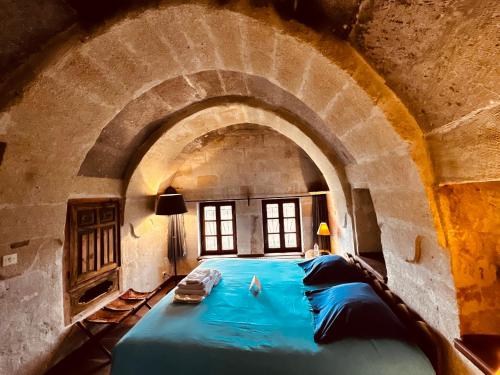 Ένα ή περισσότερα κρεβάτια σε δωμάτιο στο Les Maisons De Cappadoce
