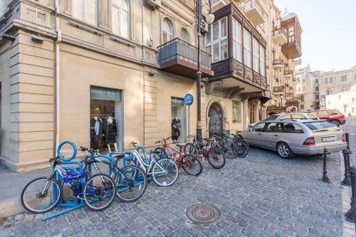 a group of bikes parked in front of a building at Old Baku Inn Hotel in Baku