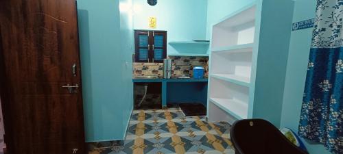 a room with a hallway with a door and a floor at Shanti Rental And Dormitory in Kāthgodām