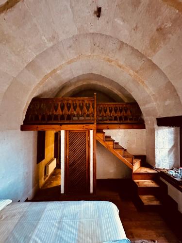 Ένα ή περισσότερα κρεβάτια σε δωμάτιο στο Les Maisons De Cappadoce