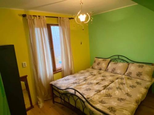 Ένα ή περισσότερα κρεβάτια σε δωμάτιο στο Guest house Velikovi