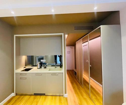 a kitchen with a sink and a counter top at 5 Star Hotel Apartments in Batumi