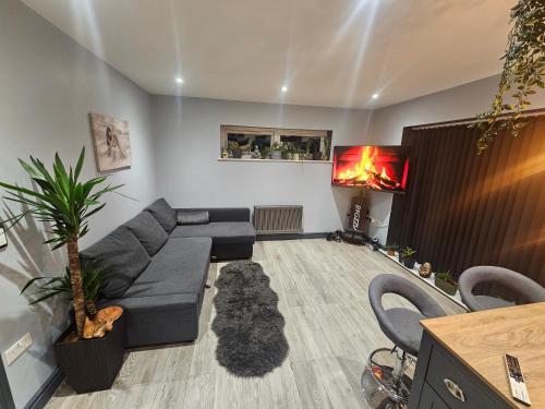 a living room with a couch and a table at Cozy Southampton Apartment Retreat in Southampton