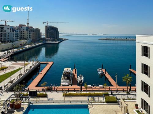 a large body of water with boats in it at HiGuest - Elegant 1BR Oasis in La Mer in Dubai