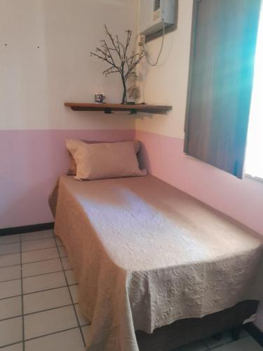 En eller flere senge i et værelse på Casa Aconchegante Porto Segur