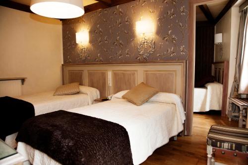 Кровать или кровати в номере Hotel Villa de Torla