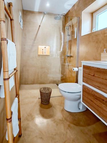 a bathroom with a toilet and a shower at Serenity House in Tinajo