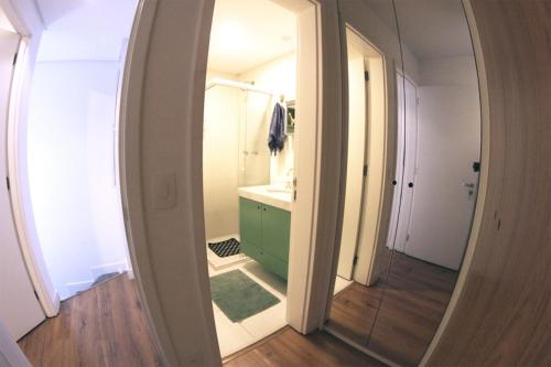 a bathroom with a green cabinet and a mirror at BV0716 I Lindo Duplex no coração de São Paulo O Mais completo in Sao Paulo