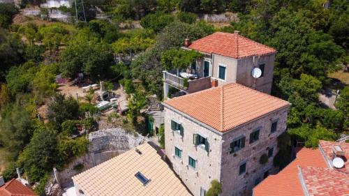 an overhead view of a building with a clock tower at Villa Šoti in Mlini