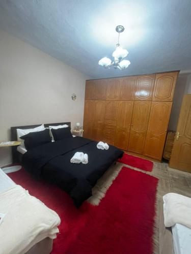 Postel nebo postele na pokoji v ubytování Ledi's Apartment