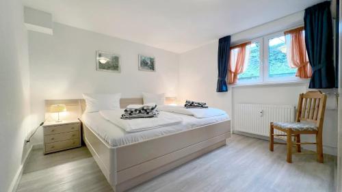 Postel nebo postele na pokoji v ubytování C-Haus Cordula, App 36