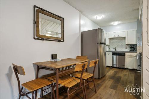 a kitchen with a table and chairs and a refrigerator at Near UT Campus Nightlife 1BR 1BA Apt Free Parkin By Austin Vacay in Austin