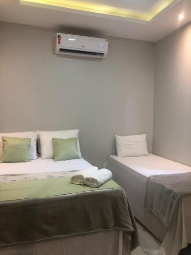 Katil atau katil-katil dalam bilik di JB Sol de Verão Hospedagem