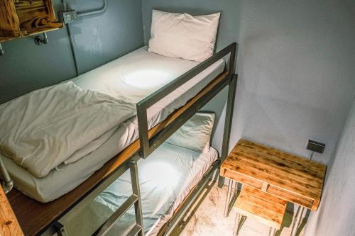 Postel nebo postele na pokoji v ubytování 62巷背包客棧 Lane62 Hostel