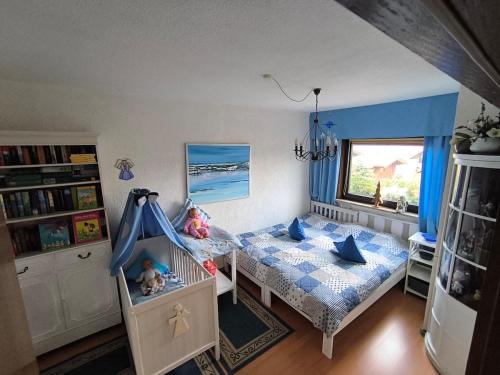 Un pat sau paturi într-o cameră la Haus Harzer Bergblick all inklusiv Sauna Whirlpool