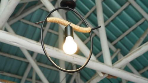 a light with a rope hanging from a ceiling at Alfa Boutique Hotel in Kiwengwa