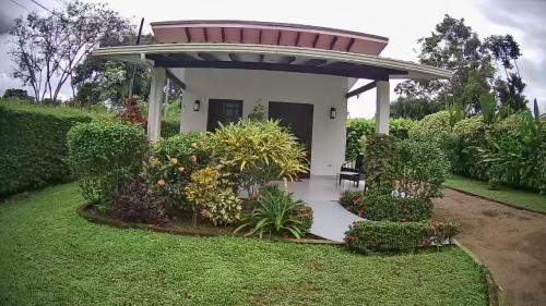 a small house with a gazebo at Casa Hibiscus in Ojochal