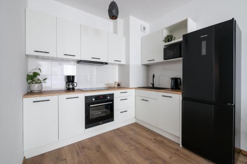 Η κουζίνα ή μικρή κουζίνα στο NAP Apartments Wyżynna Zielone Wzgórze