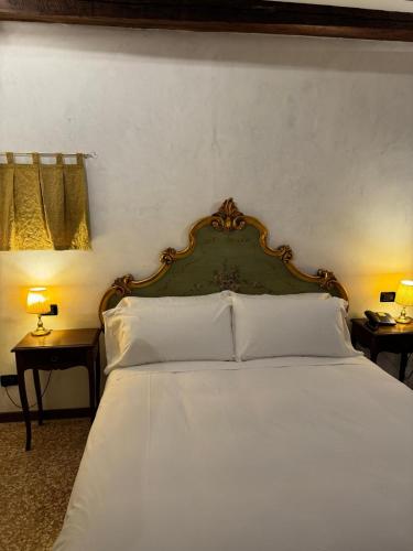 Ένα ή περισσότερα κρεβάτια σε δωμάτιο στο Hotel Guerrato