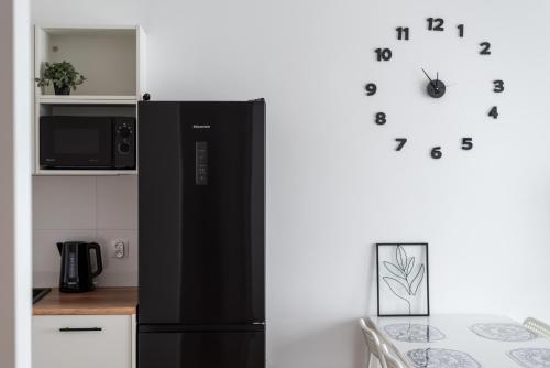 Η κουζίνα ή μικρή κουζίνα στο NAP Apartments Wyżynna Zielone Wzgórze