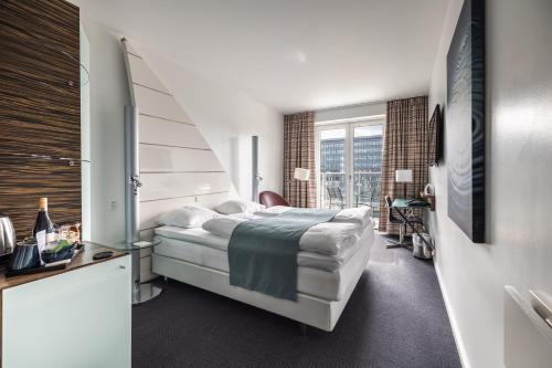 Postel nebo postele na pokoji v ubytování Copenhagen Island Hotel