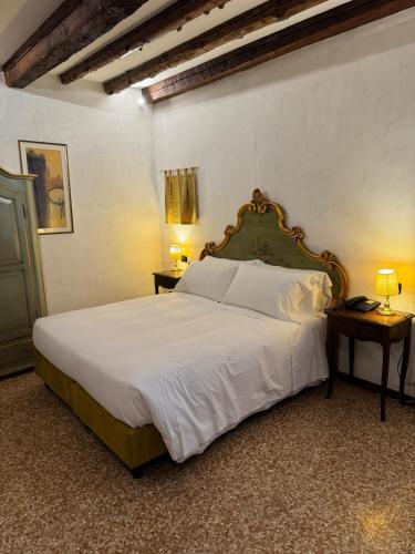 Ένα ή περισσότερα κρεβάτια σε δωμάτιο στο Hotel Guerrato
