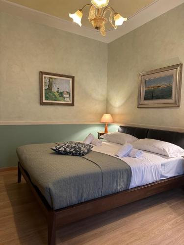 a bedroom with a large bed with a ceiling at Lady Verona Residence in Verona