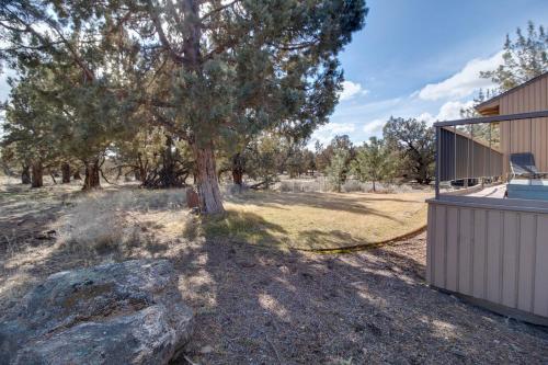 a yard with a tree and a house at Deschutes River View Eagle Crest in Redmond