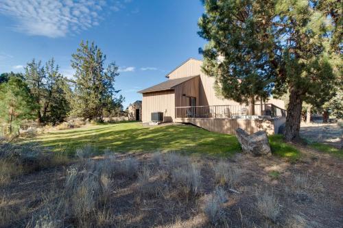 a house with a yard with grass and trees at Deschutes River View Eagle Crest in Redmond