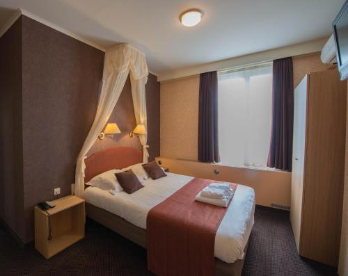 Ліжко або ліжка в номері Hotel Groeninghe