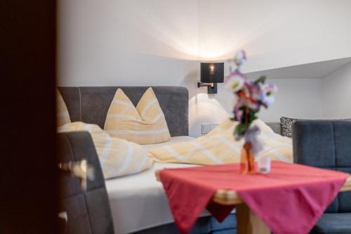 a room with a couch and a table with a doll on it at Haus Birkenheim in Sölden