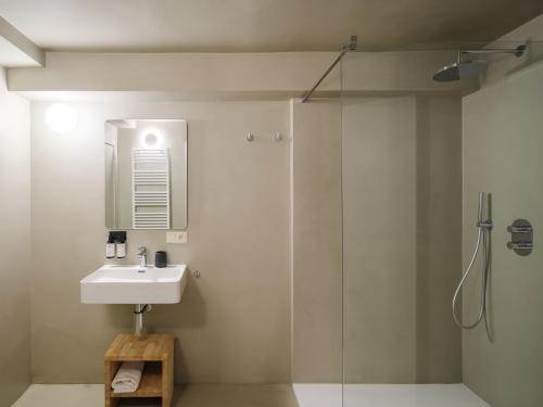 a bathroom with a sink and a shower at Lits de Lo - Boutique Rooms in Ghent