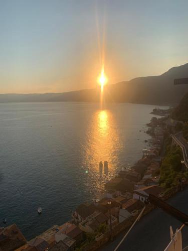 a sunset over a large body of water at Casa Vacanze Belvedere in Scilla